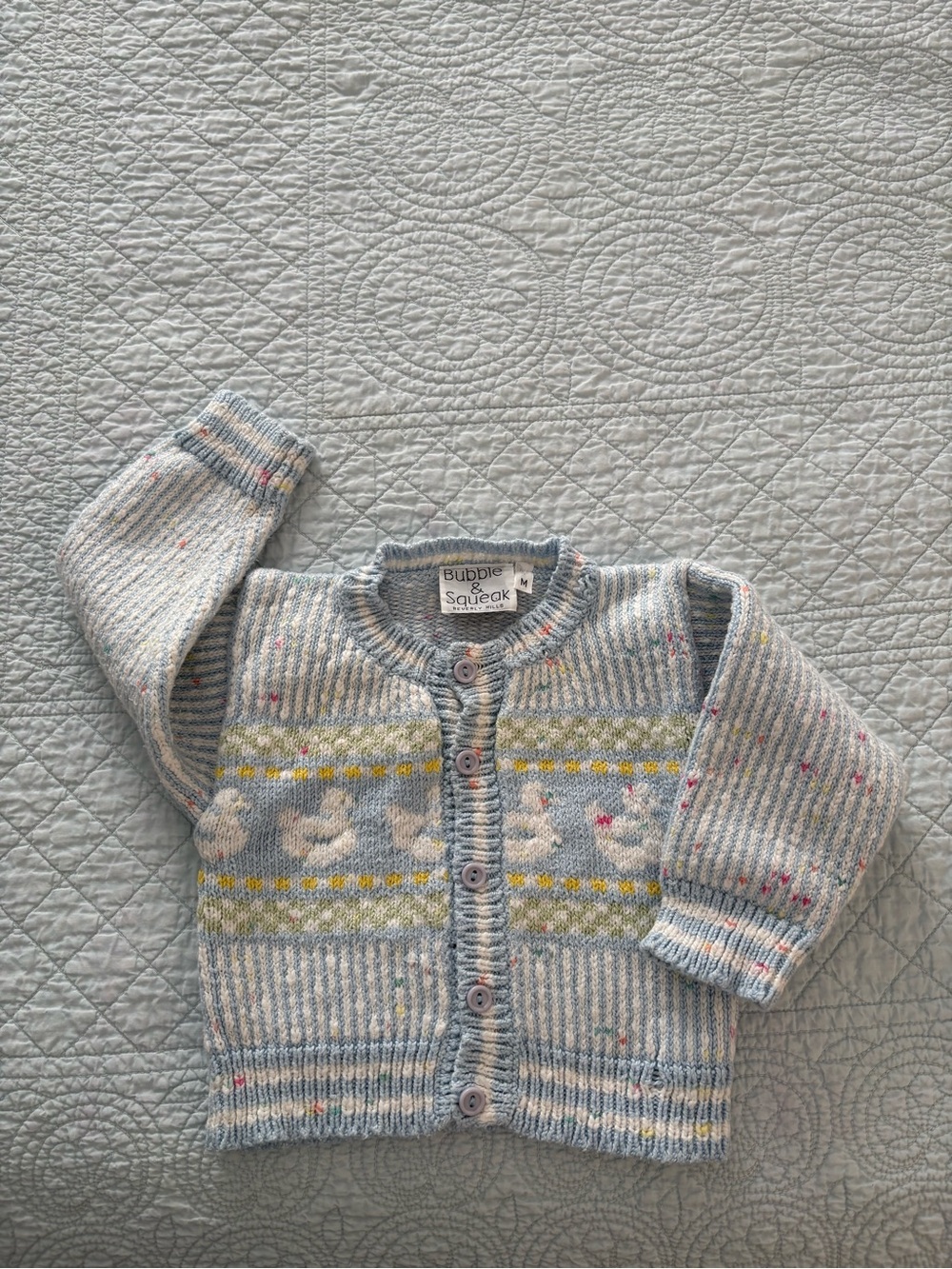 Vintage hand loomed baby cardigan.
